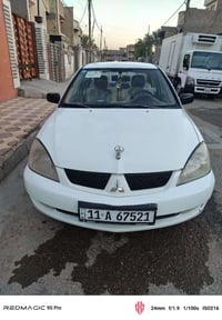 لانسر موديل 2008 مكينه 1300  بيه قطعه صبغ بلجاملغ الامامي الايسر السيا...