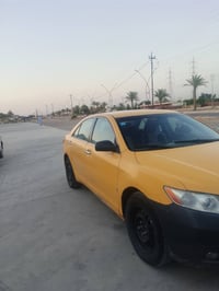 كامري موديل 2009 رقم بغداد سنويه 28 سياره مصفره هاي او غرامات وكل كير ...