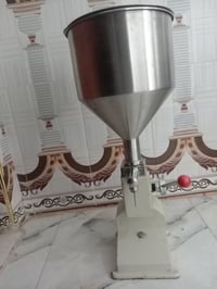 ماكينة تعبئة • يدوية • سوائل ومعجنات