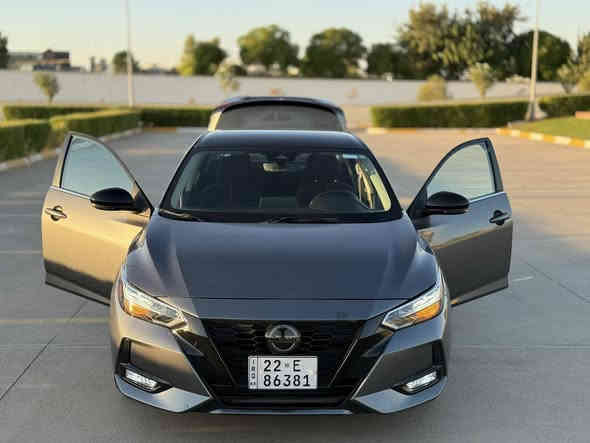نيسان سنترا SR2023 (توكلر midnight ) 🚘
الموديل: 2023
الصنف: SR MIDNIGHT 
المحرك: 2000cc – بنزين – 4 سلندر
الوارد: أمريكي ✅ ( صبغ  شبر في جاملغ امامي اليمين وبنيد مبدل بلادي بدون صبغ )

✅ جميع الأيرباكات أصلية ✅ (شرط الفحص)

ملاحظة: تخم تاير جديد هونكوك وباتري

 • رقم الشاصي: 3N1AB8DV4PY223907

 • اللون الخارجي: نفطي
 • اللون الداخلي: شمواه أسود 
 • عداد: 11000 ميل

⸻

السعر 💰15900 $ (159$ )

قابل للتفاوض بعد المعاينة فقط – لا يوجد تفاوض عبر الهاتف

⸻

المواصفات ⭐
               • سقف اسود بلادي midnight 
 • تشغيل بصمة + بصمة أبواب
       ٠ تشغيل عن بعد
 • شاشة وسطية مع نظام أبل كار بلاي
 • كاميرا خلفية + كاميرا أمامية (مساعدة الحفاظ على المسار)
 • رادار خلفي للوقوف المفاجئ
 • حساسات جانبية في المرايا
 • نظام تحديد مسرب + قيادة شبه ذاتية
 • مثبت سرعة + تحكم ستيرن
 • بلوتوث
 • حجر بيئة بلادي
 • ويل كاب SR 
      • ضو امامي وكشاف زنون اصلي
⸻

📍 موقع السيارة: أربيل
📞 للاستفسار: *********** (اتصال / واتساب / فايبر)
