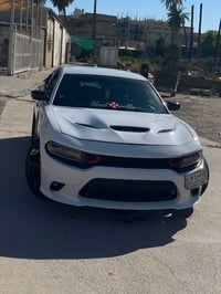 جارجر 2016 Sxt  ابيض وارد كندي  داخله كلين  هنا صاير بيهه حادث بس بنيد...