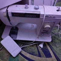 مكينة خياطة • نظيف • ضبط الخيط