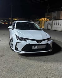 كورلا خليجي  هايبرد رقم بغداد  موديل 25 محرك 1.8 ماشيه 32 الف  كفاله  ...