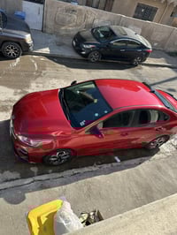 للبيع كيا فورتي رقم اربيل الجديد موديل ٢٠٢١ وارد امريكي احمر   ماشيه ٩...