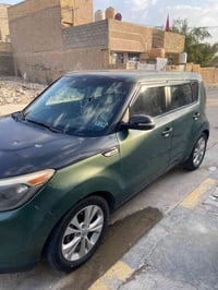 كيا صول موديل 2014 محرك 2000 رقم بغداد انكليزي اللون زيتوني وبأسمنا جا...