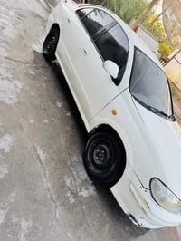 نيسان موديل الفين سياره داخله جديد  مصبوغه عام بدون ضربه كير محرك جديد...