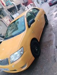 كورولا بيكاجو موديل ٢٠٠٦ اصفر رقم انكليزي بصره بأسمي المكان بغداد الشع...