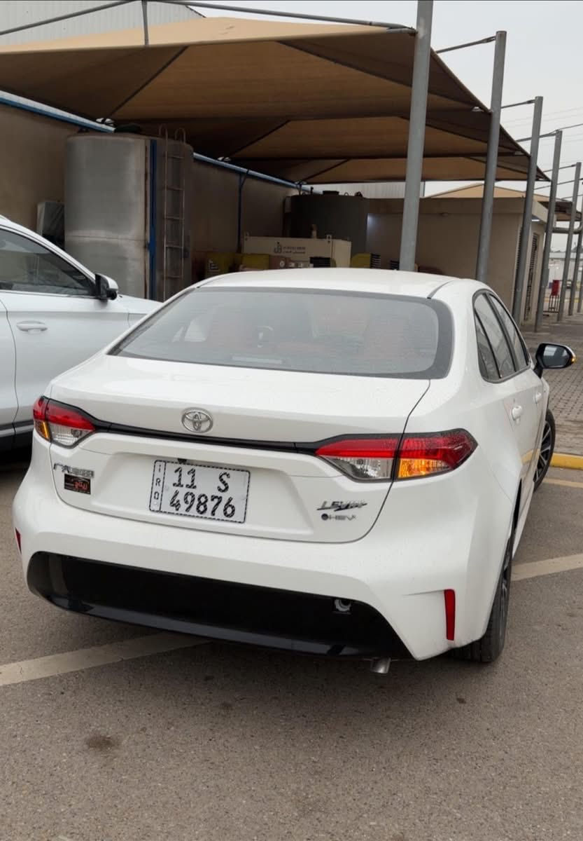 🔹 كورولا هايبرد 2025 – شكل الامريكي 🔹‏
‏HYBRID
‏MODEL 2025
‏0 KM 
‏COLOR WHITE 

محرك 1800 بانزين + هايبرد
فتحه سقف سلايت
مقاعد كهرباء 2 السائق والراكب 🔥🔥
رادار / تحديد مسار / اوتو ستوب 
مقاعد جلد احمر + اسود 
باقي المواصفات معروفه

لا تخلّي الفرصة تفوتك..السيارة جاهزة للاستلام الفوري ✅

‼️لمعرفه السعر علق برقم 1 او الاتصال‼️
دبل كرسي كهرباء وجلد ...
متوفر مرقم كامل سنويه ولوحات مثبته

عنوان الشركة📍.. بغداد - معارض البياع - الشارع الرئيسي

اوقات الدوام جميع ايام الاسبوع 
من الـ 10 صباحاً الى الـ 9:30 مساءً  

للاستفسار يرجى الاتصال على الارقام الاتية 📱:
 
***********
‭***********‬ 
***********
***********
