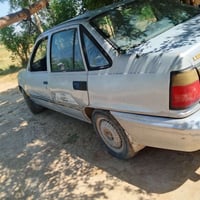 سياره كوري لمنس محرك 1600مفتوح نوزل  كير اوتوماتيك موديل 1994 رقم بغدا...