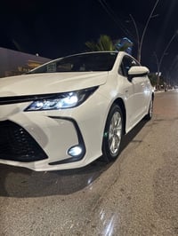 كورلا خليجي هايبرد فول 1/1  رقم بغداد  موديل 25 محرك 1.8 كفاله عده شخط...