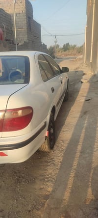 نيسان سني الفين 1  المكينه بيه خيط بخار قليل كلش 07723808409 سعر 58 وب...