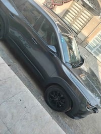 مازدا cx50 موديل 2025 رقم بغداد دولي بأسمي  ماشيه 30 الف كم  صنع يابان...