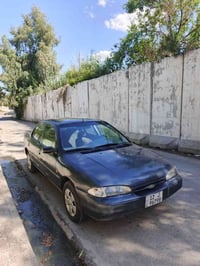 فورد مونديو للبيع ٣٢ وبيها مجال سيارة بسمي .، هزه بيها  مصبوغه عام جما...