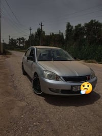 لانسر موديل 2010 كفاله عامه بدون صبغ بدون ضرر مكينه جديده كير ابو الول...