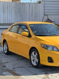 كورلا 2012 للبيع  رقم بغداد هيئة وغرامات صفر  سنوية لل28  كير ومحرك وت...