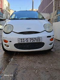 كيو كيو ٢٠١٣ ابيض كير اوتماتيك ٤ سلندر المرغوب  السيارة ماشية ٨٣ باسمي...