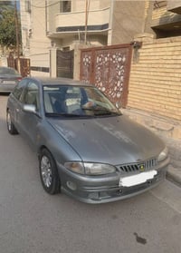 للبيع بروتون ٢٠٠١ تك باب محرك ١٥٠٠ نوزل كير اوتماتيك تبريد ثلج رقم بغد...