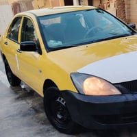 للبيع لانسر 2010 رقم بغداد تبريد ثلج تخم تاير جديده  جاملق امامي وقبق ...