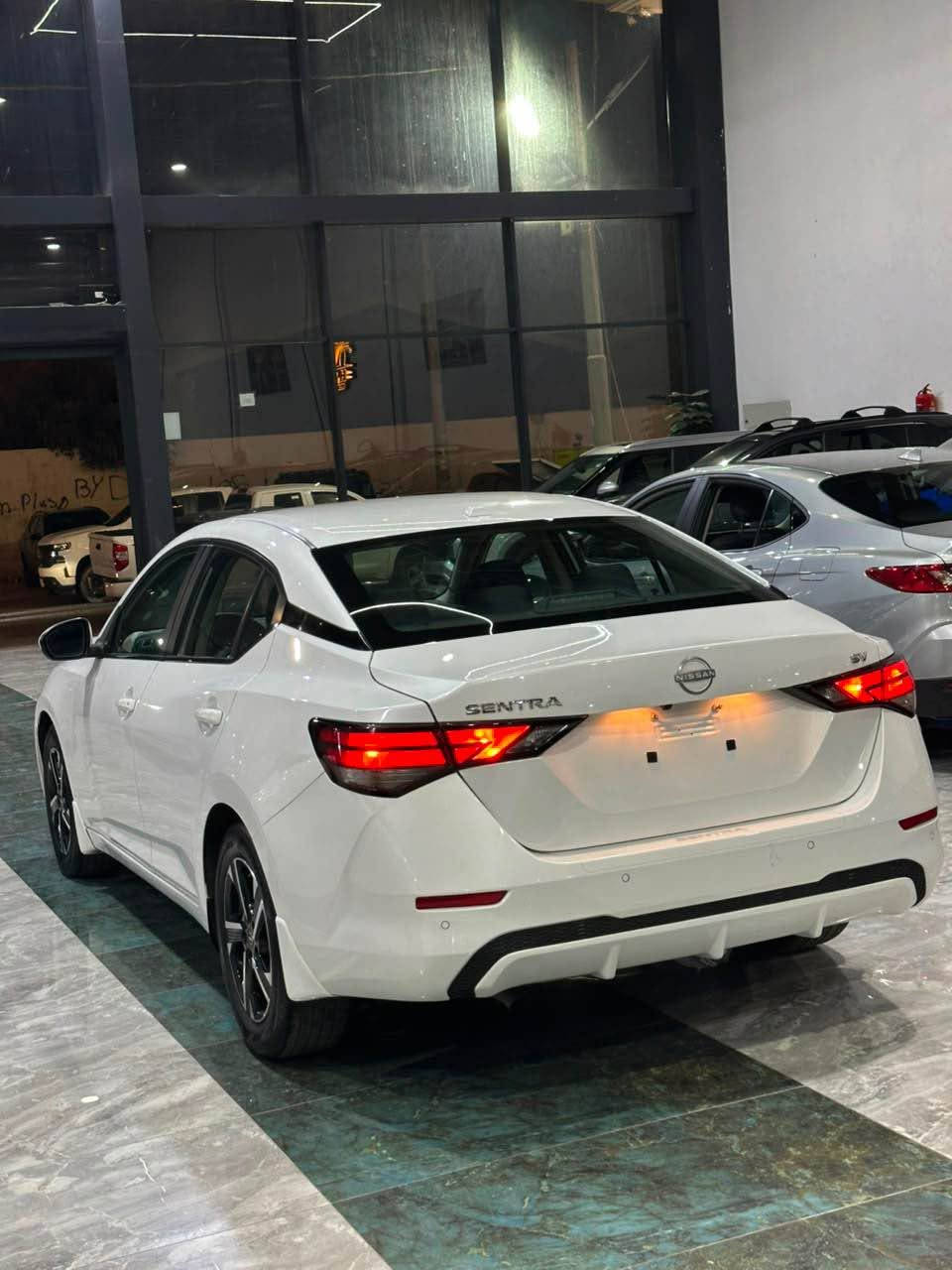 بسم الله الرحمن الرحيم 
NISSAN SENTRA SV
مۆدێل 2024
مواسەفات SV 
سەیارەکە بی سبوخە یەک جی بچووک pdr هەیە بیژۆری بەشەرتی بەهەموو شتەک 

سەیارەکە ئیرباگ ی شان و سوکانی تەقیە بەشەرت دانریتەوە دەشبوول بەشەرت 

ماوەی رۆیشتنی 16.000مایل 
                             
مەکینە و گیر بەشەرتە 

فوول مواسەفاتە ( کامیرەی دواوە ،  ،سندوقی کارەبای ،
راگری نشیوی ، حاساس ، کوشن گەرم ،  
بەسمە ، شاشە ، ئاوینە رادار ، 
6 ئیرباگ ، ئەپل کار پلەی )

سەیارەکە زۆر تەنک و ریک و پیکە  
سعر(١٤٥)مەجالکی کەمی تیدایە (***********) أربيل, العراق
