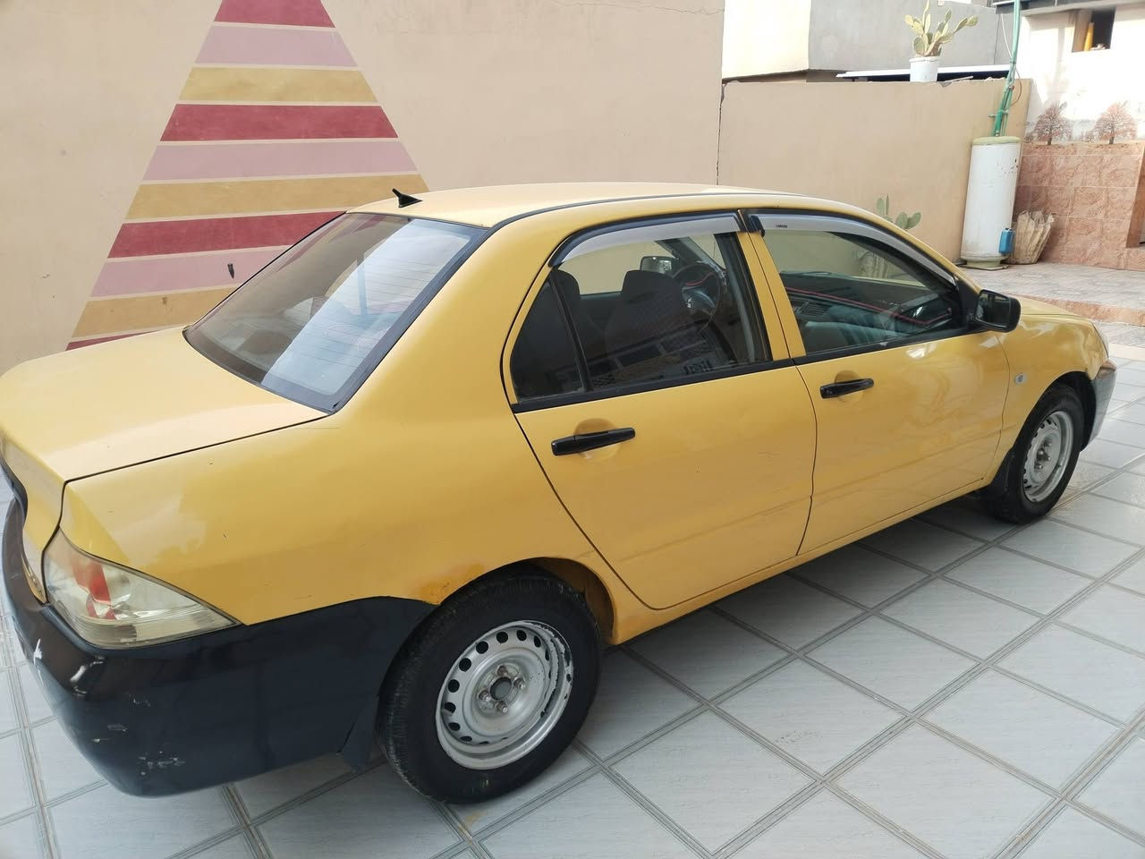 السلام عليكم لانسر موديل 2010 باسمي كير ومكينه خير من الله صدر خلفي أمامي تخم تاير خير من الله بدون ضرر والسونار مرفق السياره مكفوله السعر ٨٠ وبه مجال رقم الهاتف *********** العنوان ديالى سراجق
