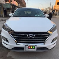 توسان للبيع  موديل ٢٠٢١ رقم بغداد  وارد امريكي ضربتهه بجم خفيف كير محر...