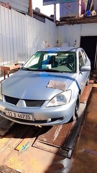 لانسر موديل 2007سياره نضيفه بعنه كلمه مصبوغه حزام العلوان شهداء العبيد...