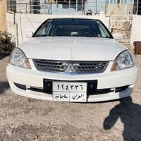 میستربۆشی لانسەر 2011 مواسەفات GLX  ڕەنگی سپی گێر ئۆتۆماتیک  بێ بۆیاغی...