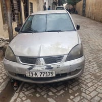 لانسر بومة ٢٠٠٣ وارد امريكي محرك ٢٠٠٠  المرغوب كير ومحرك جيد صدر امامي...