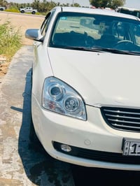 اوبتيمه للبيع موديل2006سياره بيها فخذه سعر 75وبيها مجال الاستفسار07748...
