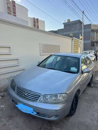 نيسان سني موديل2000 رقم بصره مشروع وطني  سنويه 2028 تنتهي مصبوغه عام  ...