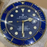 ساعات جداريه • شكل رولكس • اطار حديد