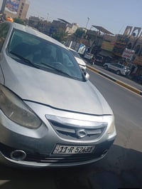 رينو فلاونس موديل ١٢ رقم بغداد انكليزي باسمي مكاني بغداد  لون سلفر سيا...