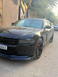 دوج جارجر SXT   موديل 2023 لون اسود     رقم بغداد مشروع وطني تحويل مبا...