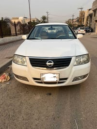 نيسان صني للبيع موديل 2009 لون ابيض بغداد السيارة كفالة عامه الكير وال...