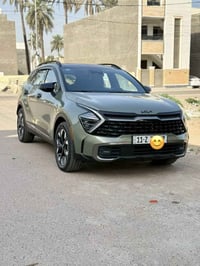 سبورتج 2023 بلكن شحن كهرباء وشحن تلقائي وبانزين ماشيه 30 الف رقم بغداد...