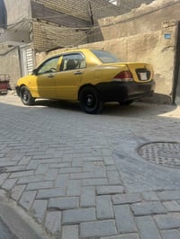 لانسر للبيع 2009وارد امريكي ضربه جطنه كير اوتماتيك مكينه 1500مكان بغدا...