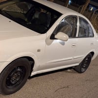 نيسان سني بدي كوري 2009 رقم بغداد  محرك كير جيد  تبريد ثلج صدر كامل جد...