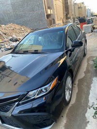 كامري موديل 2021 رقم بغداد باسمي السيارة نضيفة محرك كير كهربائيات تبري...