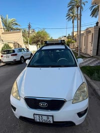 كيا كارنز للبيع  موديل ٢٠٠٨  . خليجي مكفوله  . رقم بغداد  .محرك دوش  ....