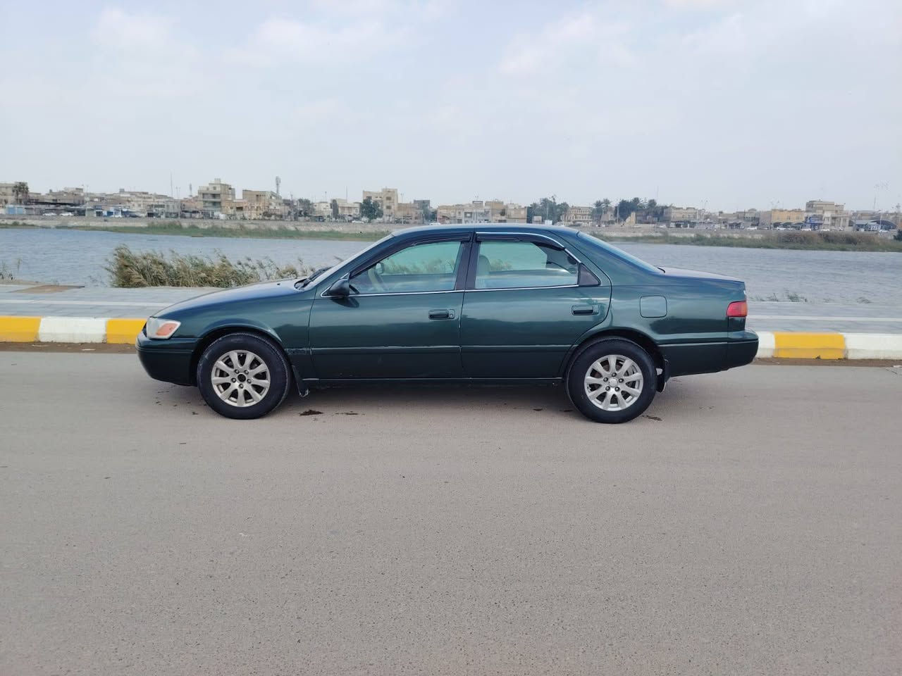كامري للبيع موديل 2000  محرك 2000 ابو الكف جديد كير جديد  وارد امريكي حدادية كهربائيات كلشي جاهز تبريد ثلج تخم تاير جديد دوشمة جلد ارضية جلد صبغ عام جمالية فقط سيارة نضيفة وخير من الله رقم بصرة سعر 57 وبيه مجال ناصرية مركز ***********
