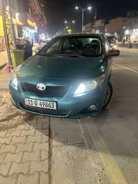 07713197865/07813863192 واتساب  كورلا موديل 2009 وارد امريكي رقم بغداد...