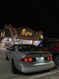 كامري موديل 2001 وارد امريكي  رقم بغداد مشروع وطني بأسمي السياره  مصبو...