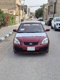 سيارة 🚗 كيا ريو موديل2006 لون احمر ماروني السيارة مصبوغ حزام بدون ضربة...