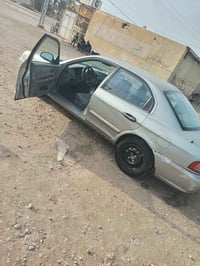 أوبتما 2004 محرك2000 رقم بغداد كير ومحرك وتبريد مكفول  السعر 53 بيها م...