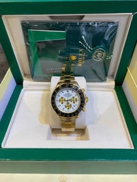 رولكس دايتونا • ذهب عيار 18 • كرونوغراف