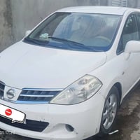نيسان فيرسا 2007 لون ابيض مكينة 2000، كير CVT ، وارد امريكي حادثها قطع...