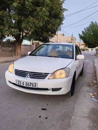 لانسر 2009 مكينه 1500 داخل عسلي كير و مكينه و صدر و تايرات وتبريد شرط ...