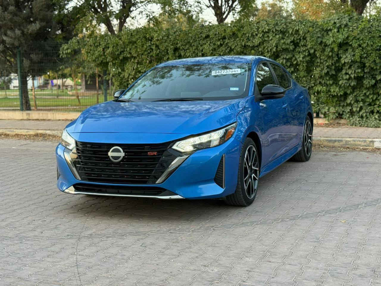 نيسان سينترا 2024 SR أعلى فئة و لون بحري المِميز
عداد المسافة : 20 الف ميل (بحالة الزيرو) 
حجم المحرك : 2000 (4 سلندر)
((((مرقم دهوك    وجاهز))) 

فـــول مـــواصفـــات فول بس بدون فتحه
ضربته:: بس بوند صبخ بدون معجون
ايرباك استيرن راجع اصلي
  
مواصفات 👇🏻
 بصمة ابواب 
بصمة تشغيل 
تشغيل عن بعد 
سستم سماعات  
شحن وايرليس
كاميرا خلفي
اوتو هولد 
اوتو ستارات 
اوتو ستوب 
رادار امامي (فقط يحتاج معايرة)
رادار جانبي  (نقاط عمياء)
رادار خلفي (التحذير من الاصطدام)
حساسات امامي
حساسات جانبي 
حساسات خلفي 
نظام (𝐄𝐂𝐎)
نظام (𝐍𝐎𝐑𝐌𝐀𝐋)
نظام (𝐒𝐏𝐎𝐑𝐓)
كشنات جلد
كشنات كهربائي
كشنات هيتر
تحكمات استيرن
استيرن هيتر
تبريد لمس 
تبريد مركزي 
لايتات ليـــLEDـــد عدسة زينون بيلادي
بكلايتات ايـــLEDـــد بيلادي
السعر 143$و بها مجال قليل
مكان السيارة بعشيقه 

متواجد إتصال هاتف ***********
وتساب ***********.
اسيا
***********
