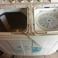 غسالة ملابس • منزلية