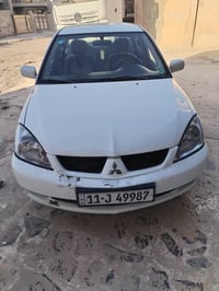 لانسر ٢٠١١ بسمي سنويه لل ٢٩ سياره جاهزه من كلشي بيها تبديل قبق صندوق و...